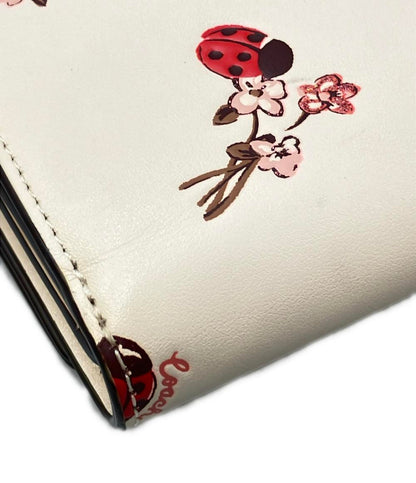 COACH 二つ折り財布 レディバグ フローラルプリント レディース コーチ